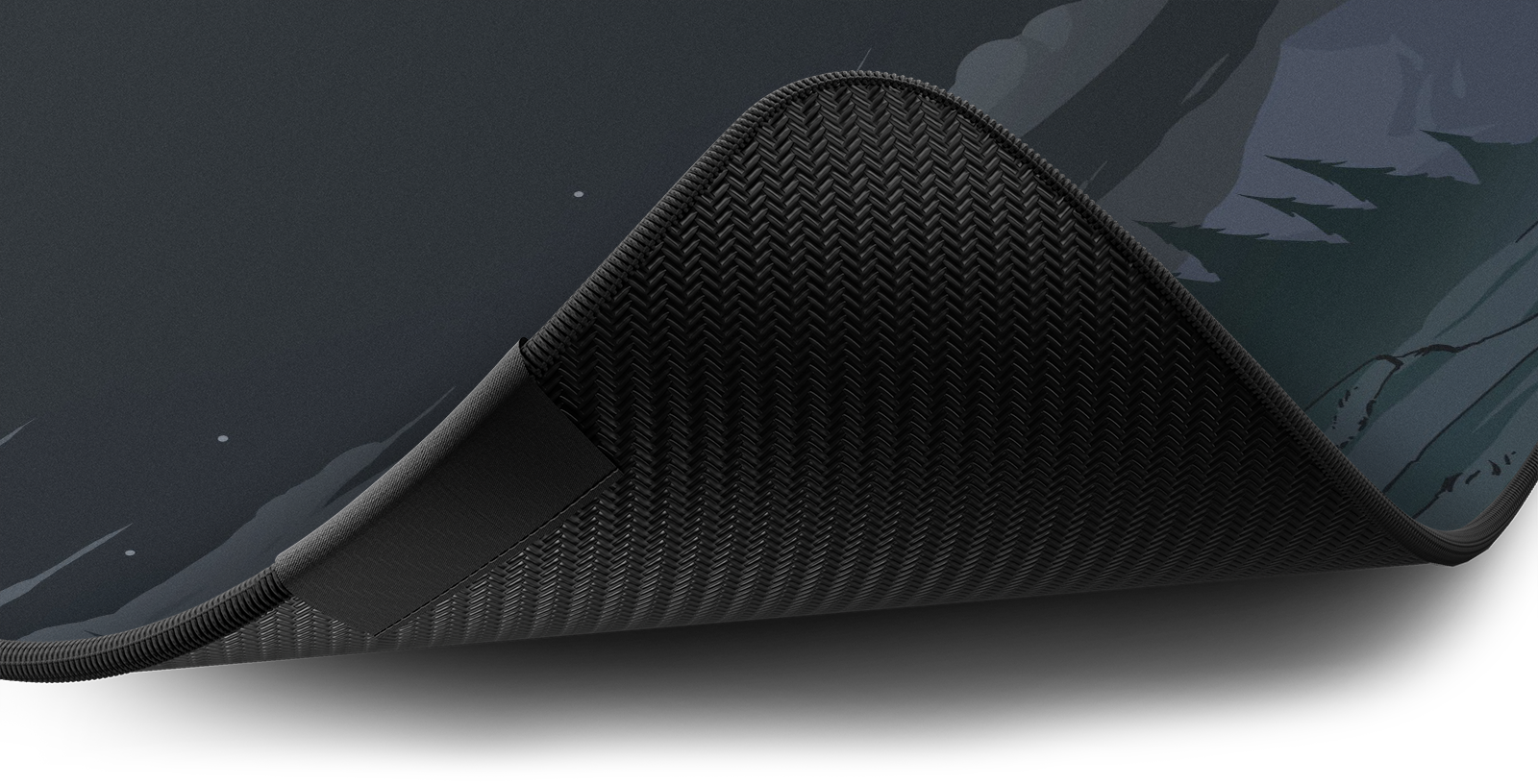 Close-up of the stitched edge and non-slip rubber base of the Hystar Eye of Cthulhu deskmat