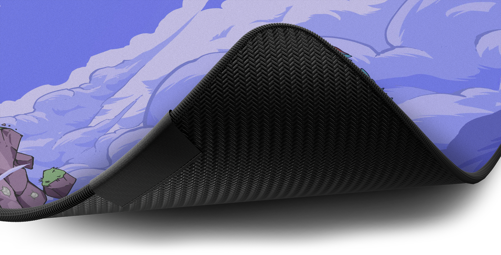 Close-up of the stitched edge and non-slip rubber base of the Hystar Floating Island deskmat