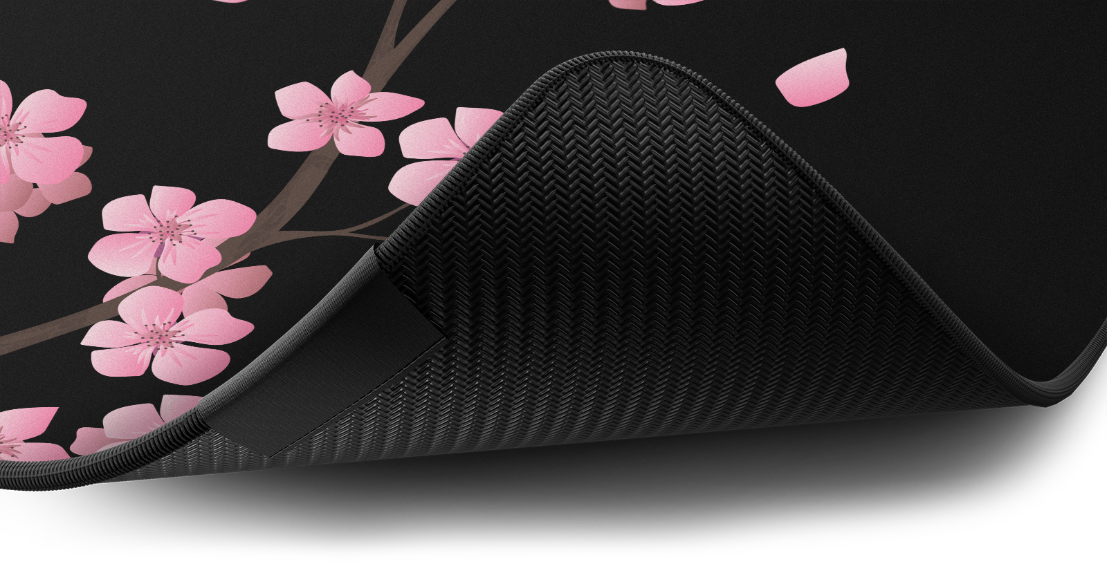 Close-up of the stitched edge and non-slip rubber base of the Hystar Blossom deskmat