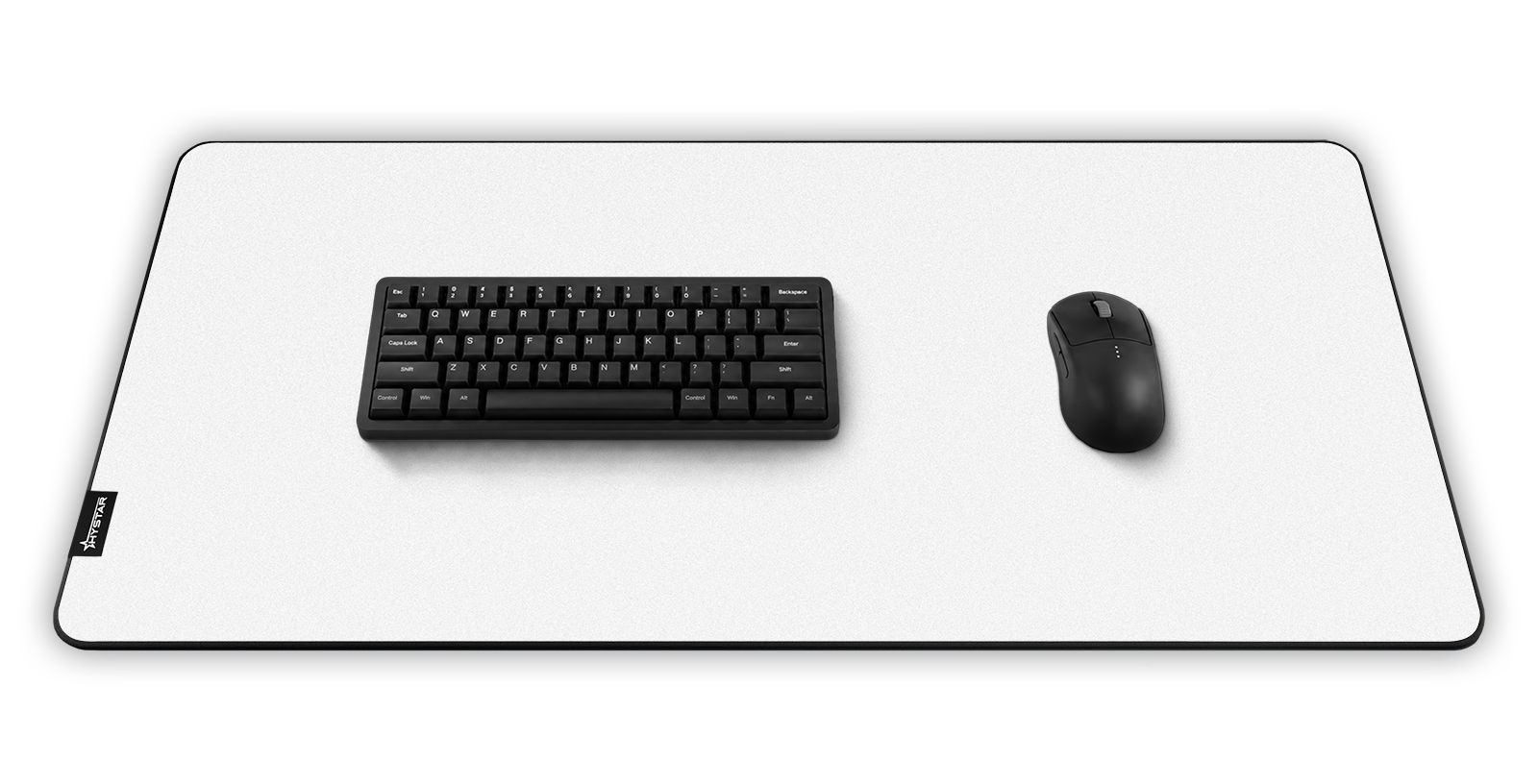 Hystar Classic deskmat in White, shown in a desk setup with keyboard and mouse. White XXL (36" x 16"), White XXXL (45" x 20")