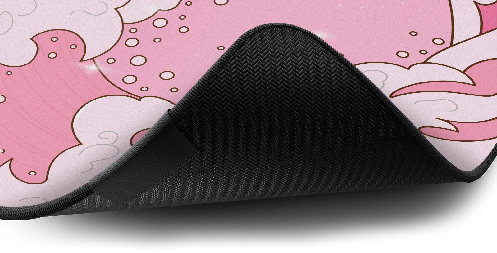 Close-up of the stitched edge and non-slip rubber base of the Hystar Kawaii Wave deskmat
