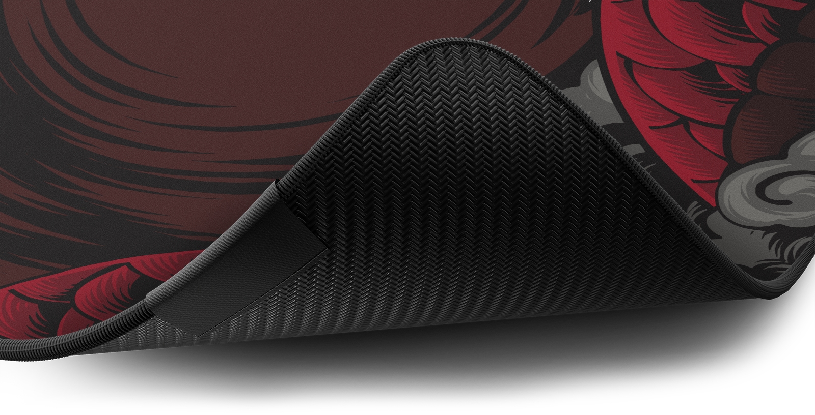 Close-up of the stitched edge and non-slip rubber base of the Hystar Dragon deskmat