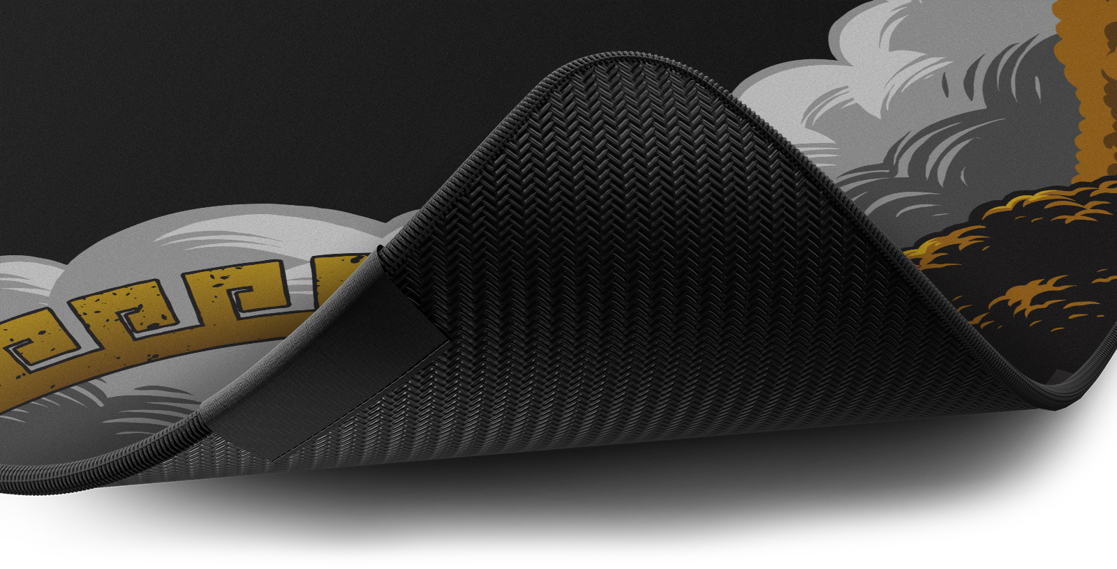 Close-up of the stitched edge and non-slip rubber base of the Hystar Griffin deskmat