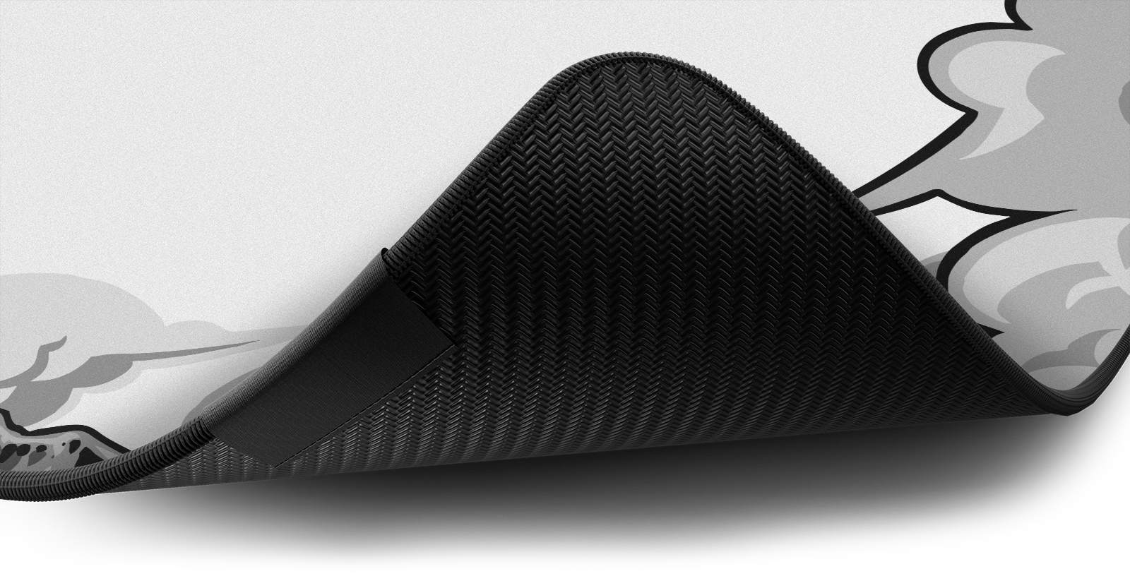 Close-up of the stitched edge and non-slip rubber base of the Hystar Pegasus deskmat