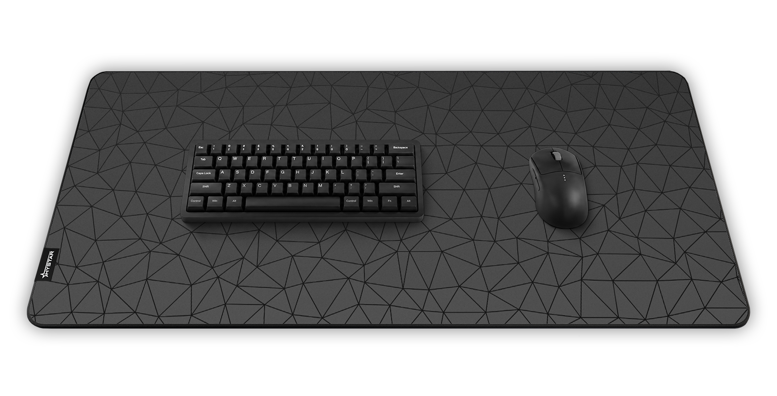 Hystar Poly deskmat in Black, shown in a desk setup with keyboard and mouse. Black XXL (36" x 16"), Black XXXL (45" x 20")
