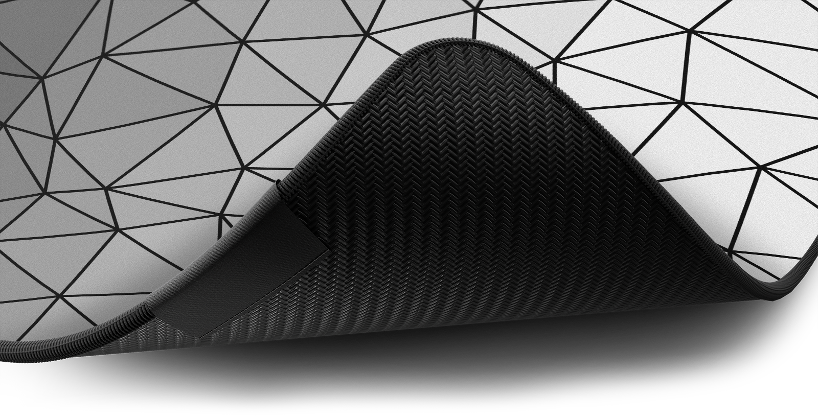 Close-up of the stitched edge and non-slip rubber base of the Hystar Poly deskmat in White. White XXL (36" x 16"), White XXXL (45" x 20")