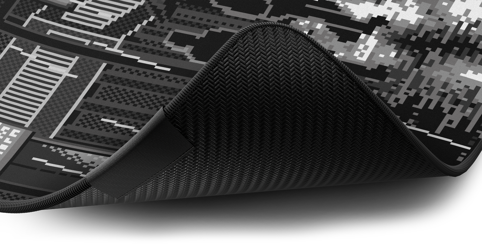 Close-up of the stitched edge and non-slip rubber base of the Hystar Retro Tokyo deskmat in Black and White. Black and White XXL (36" x 16"), Black and White XXXL (45" x 20")