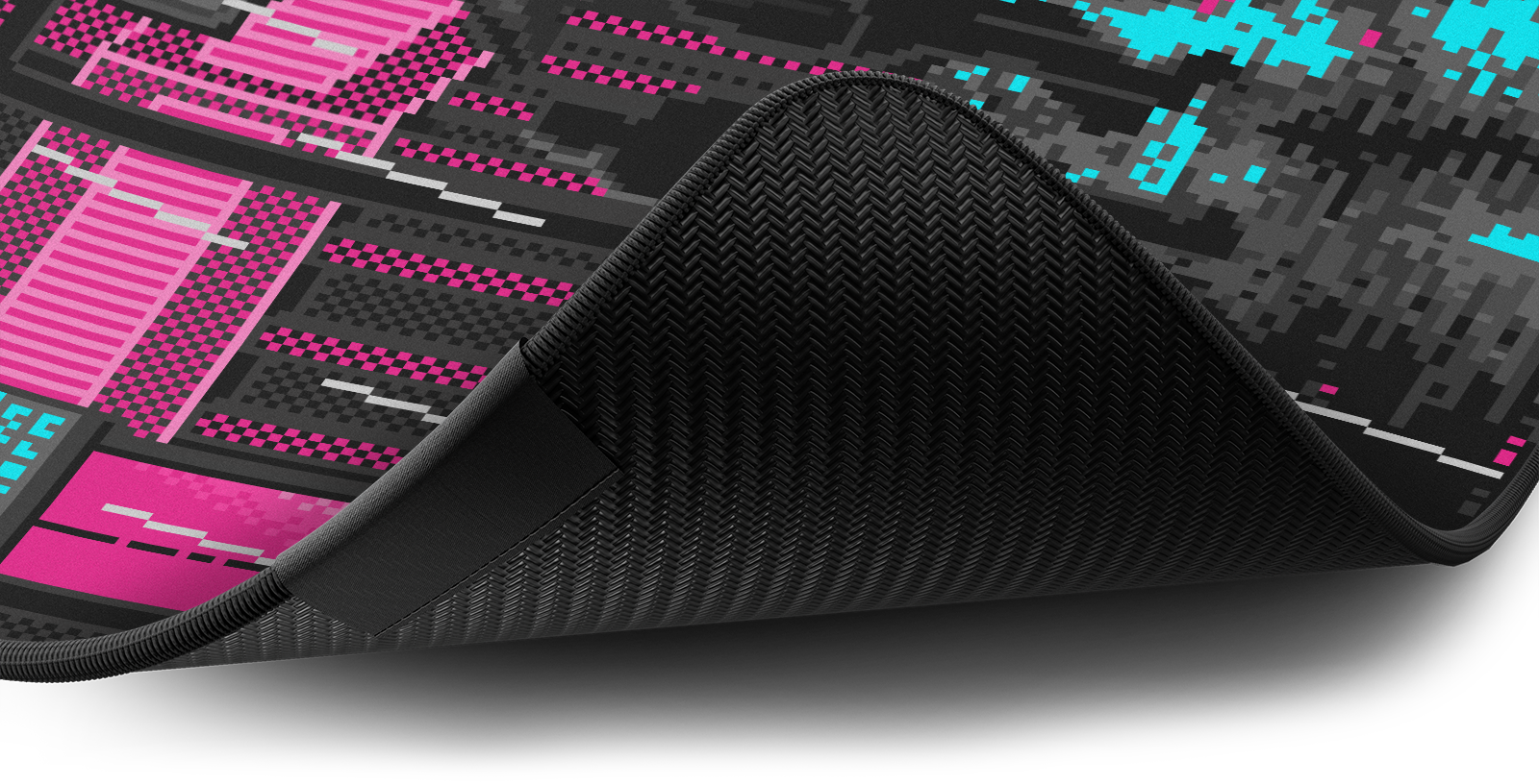 Close-up of the stitched edge and non-slip rubber base of the Hystar Retro Tokyo deskmat in Pink and Teal. Pink and Teal XXL (36" x 16"), Pink and Teal XXXL (45" x 20")