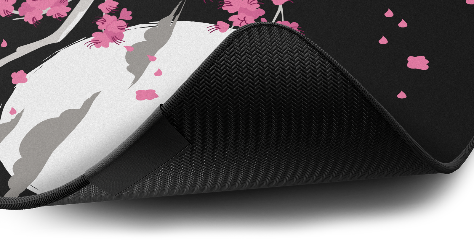 Close-up of the stitched edge and non-slip rubber base of the Hystar Sakura deskmat in Dark. Dark XXL (36" x 16"), Dark XXXL (45" x 20")