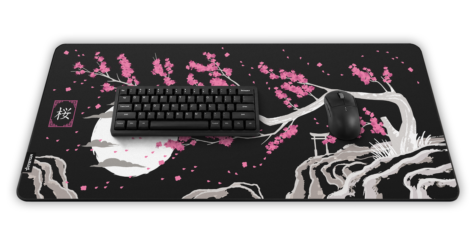 Hystar Sakura deskmat in Dark, shown in a desk setup with keyboard and mouse. Dark XXL (36" x 16"), Dark XXXL (45" x 20")