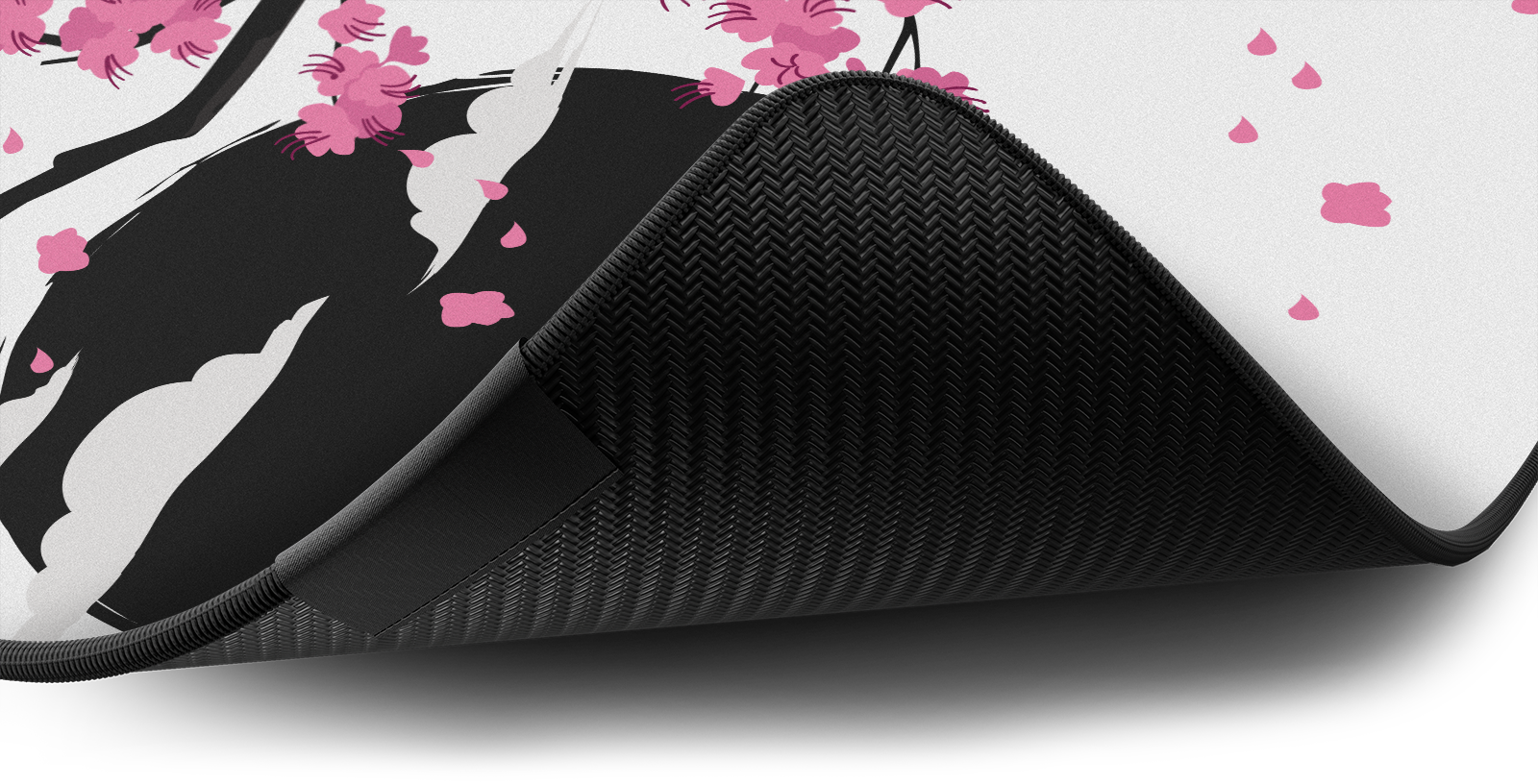 Close-up of the stitched edge and non-slip rubber base of the Hystar Sakura deskmat in Light. Light XXL (36" x 16"), Light XXXL (45" x 20")