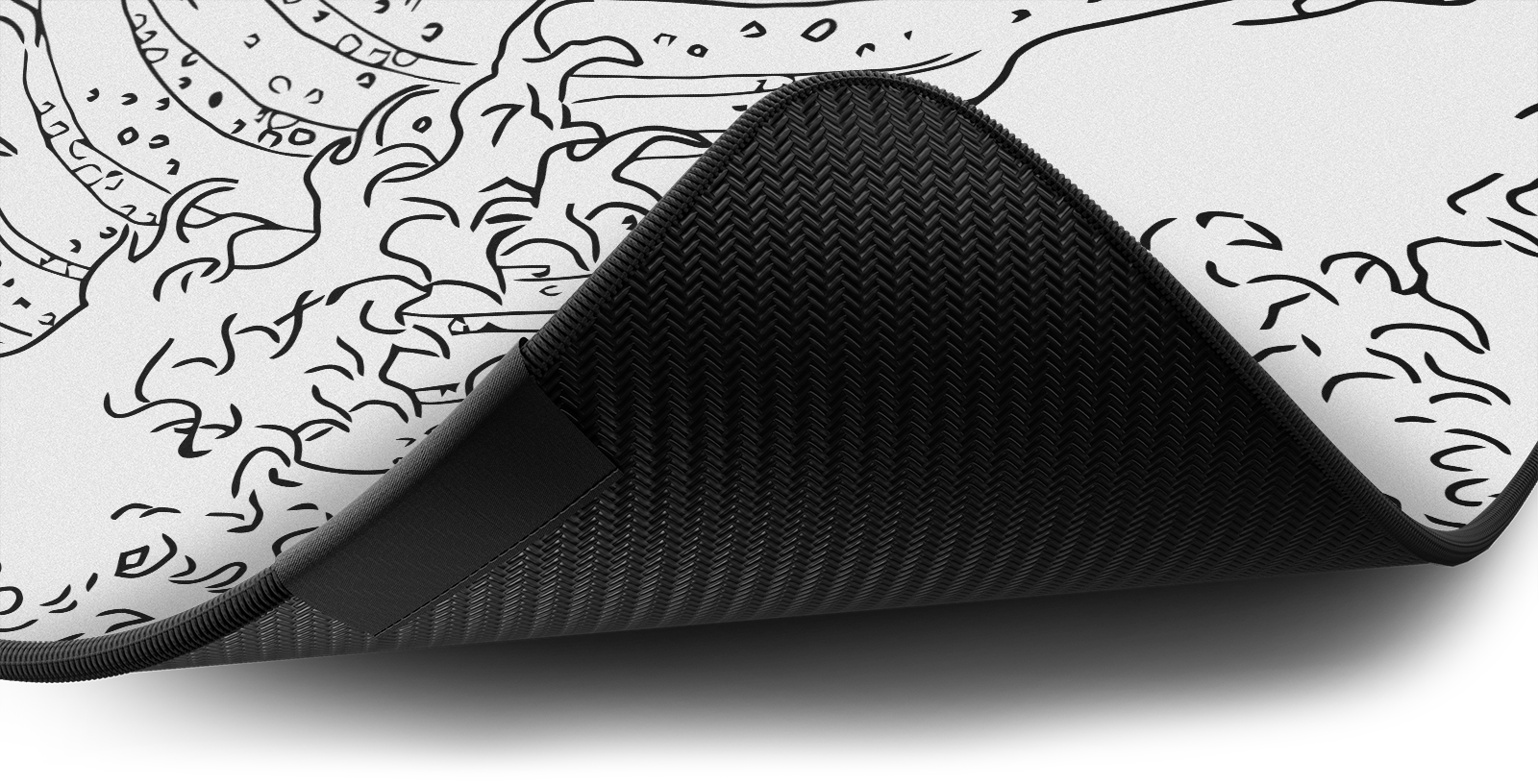 Close-up of the stitched edge and non-slip rubber base of the Hystar The Great Wave deskmat in White. White XXL (36" x 16"), White XXXL (45" x 20")